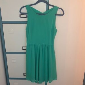 Seafoam green dress with crossing detail in back